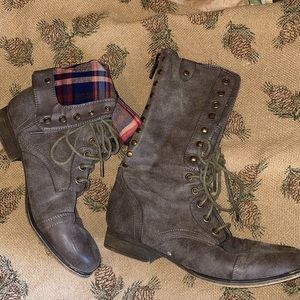 Grey mid calf or ankle size boots.